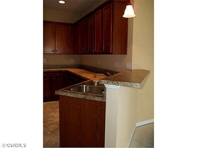 Kitchen - The kitchen has a breakfast bar for catc