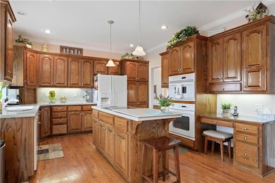 Kitchen island with glass cooktop, desk and extra 