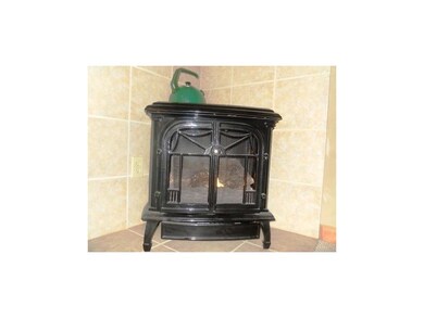 Propane stove for ambiance and additional heat