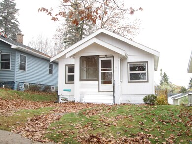 View of front of property featuring a sunroom
