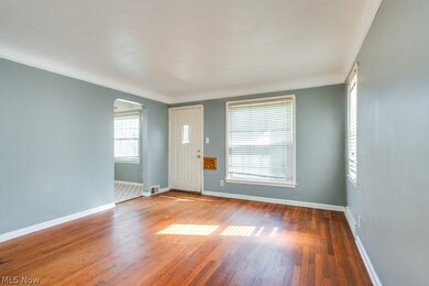 Living room featuring dark hardwood flooring