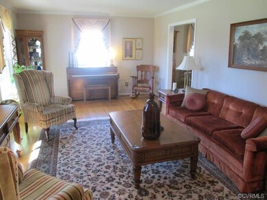 Large Formal Living Room with Hardwood Flooring