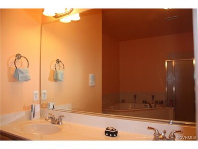 View of master bath with separate shower and corne