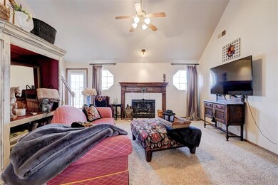 Living room featuring carpet floors, lofted ceilin