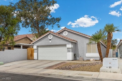 View of front of home featuring stucco siding, dri