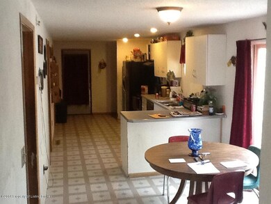 Long, open kitchen/dining floor plan.
