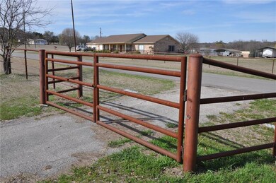 Pipe fencing and gates across much of property