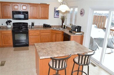 Bright and spacious eat-in kitchen that opens to t