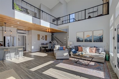 Main living area with a view of the upstairs