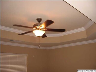 Notice the ceiling and fan in master bedroom