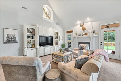 Living room with building-in's and double sided fi