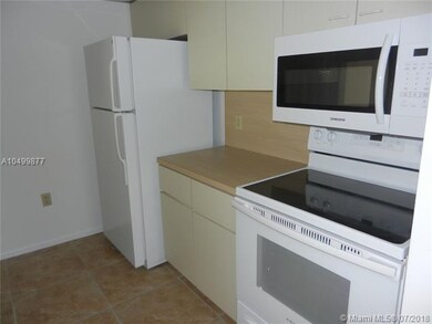 Kitchen with brand new dishwasher, range, microwav
