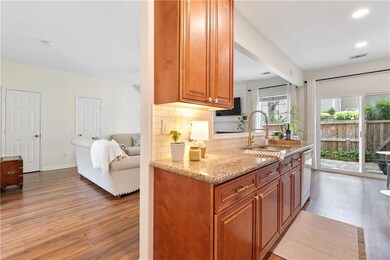 Kitchen with decorative backsplash, dark wood-styl