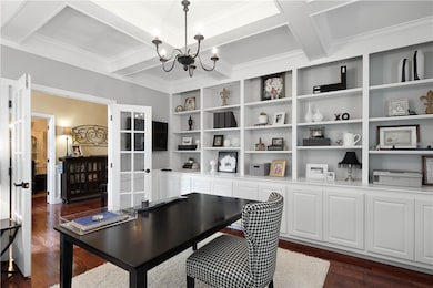 The boxed beam ceiling adds a touch of elegance to