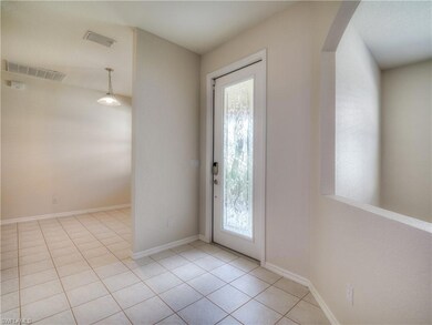 Front Door in between Den and Dining Room