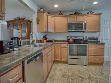 Upgraded kitchen has beautiful maple cabinets, SS 