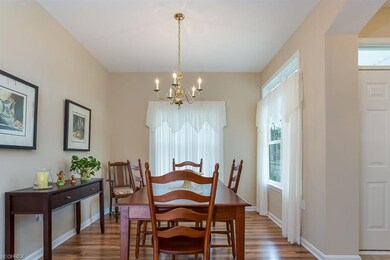 The dining room boasts beautiful wood laminate flo