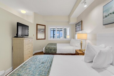 Bedroom with dark wood-type flooring