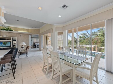 Tiled dining area featuring ornamental molding
