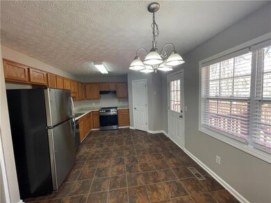 Kitchen featuring light countertops, visible vents