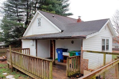 Covered back porch area with deck.