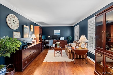Home office featuring wood finished floors and cro