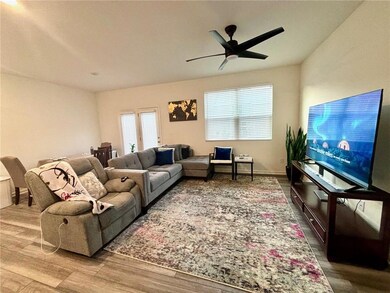 Living room with hardwood / wood-style flooring an