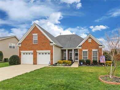 Beautiful brick veneer and vinyl exterior with roo