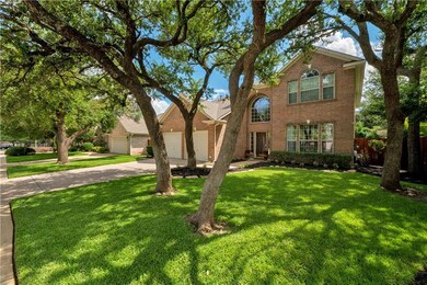 Traditional-style house with concrete driveway, a