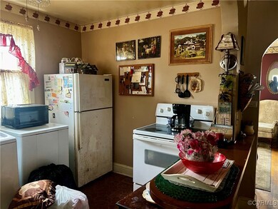 Kitchen featuring washer / clothes dryer and white