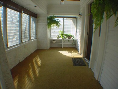 Comfortable screened front porch entry where you c