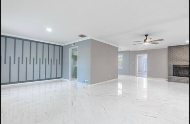 Unfurnished living room featuring crown molding, c