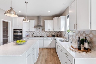 Fantastic aray of top line stainless appliances, soft close cabinetry, and quartz counters! You will love this kitchen! Finishes will vary.