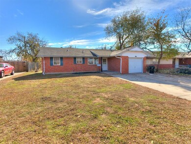 Ranch-style home with a garage and a front yard