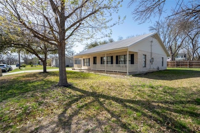 View of front of house with a front lawn, fence, 