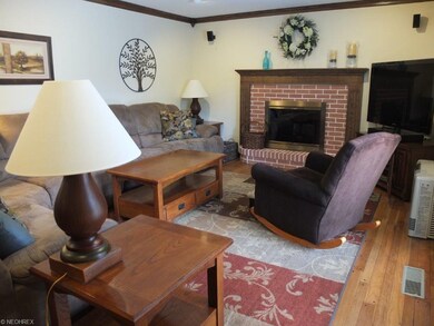 Family room has gas fireplace, crown molding and s
