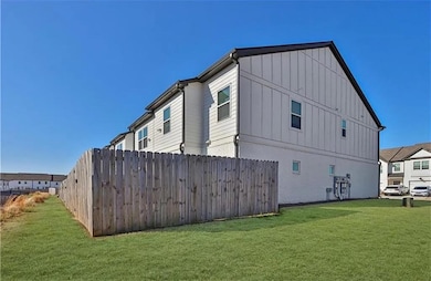 View of side of home with board and batten siding,