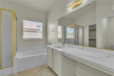 Bathroom with a shower stall, a bath, vanity, a wa