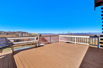 Upper deck on west side off living room with trex decking, built-in seating and outstanding views