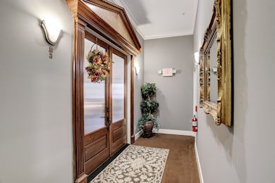 Entry to Condo 3B is through custom beveled glass