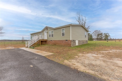 Manufactured / mobile home featuring stairway, fen