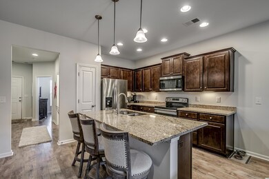 Granite coutertops, are enhanced with beautiful wo