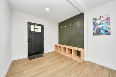Great mud room feature wall in the foyer