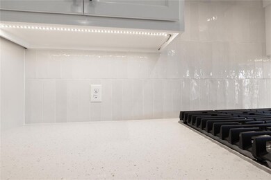 Kitchen view of stainless steel gas stovetop