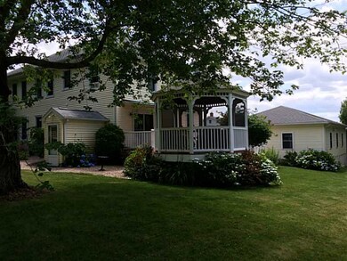 Exterior Back. back yard looking at gazebo and gar