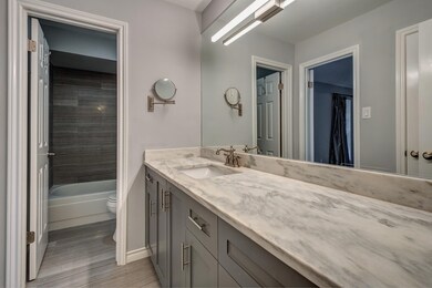 This en suite bathroom features a modern design wi