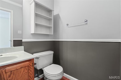 Bathroom featuring vanity and ornamental molding