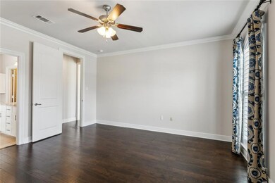 Primary bedroom leading to primary bath