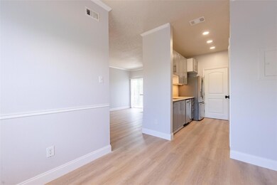 Kitchen with light wood finished floors, light co