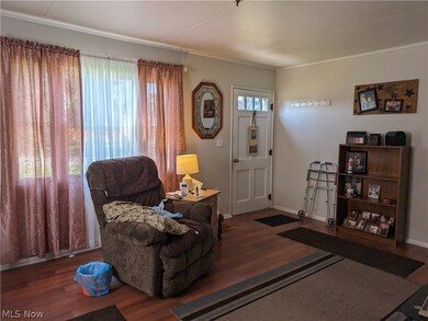 Living room with hardwood / wood-style flooring